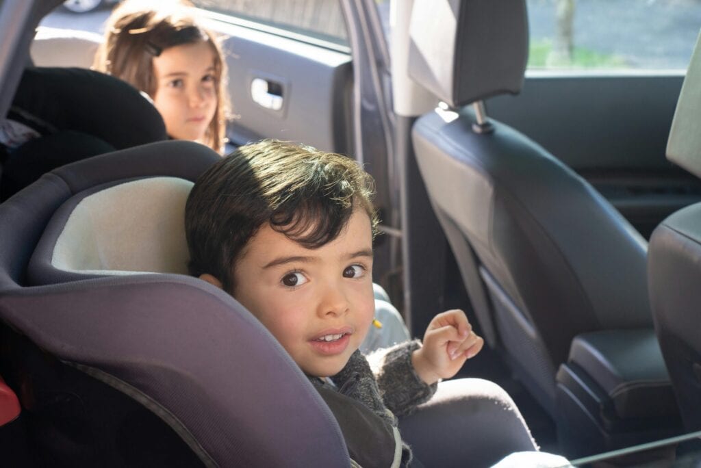 "Image title": "Children in Car Seat After Accident",.