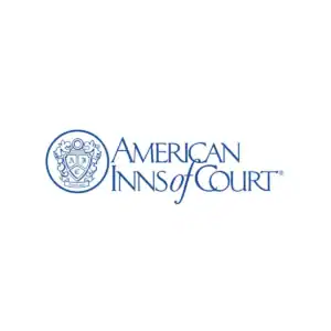 Logo of American Inn of Court featuring a shield and emblem.